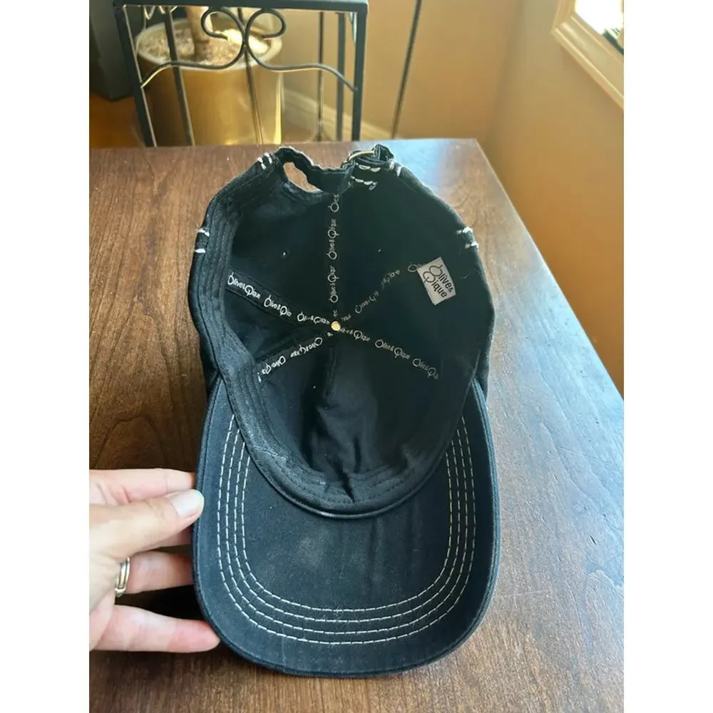 Olive & Pique quilted baseball cap featuring an iridescent rhinestone flower